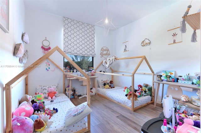 bedroom with light wood-type flooring