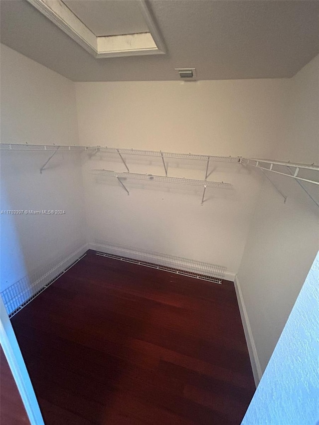 spacious closet featuring hardwood / wood-style floors