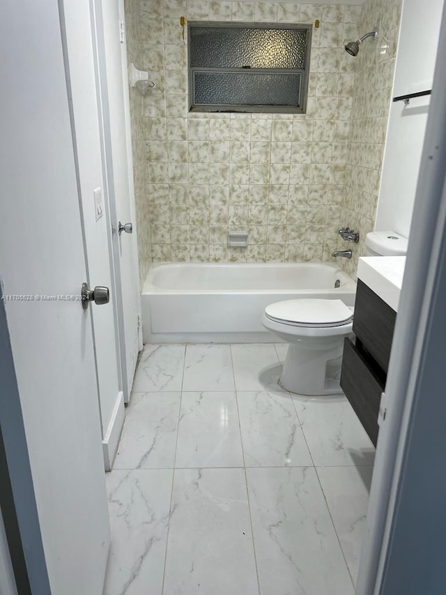 full bathroom featuring vanity, toilet, and tiled shower / bath combo