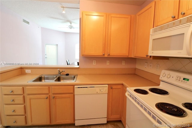 kitchen featuring decorative backsplash, a textured ceiling, white appliances, ceiling fan, and sink