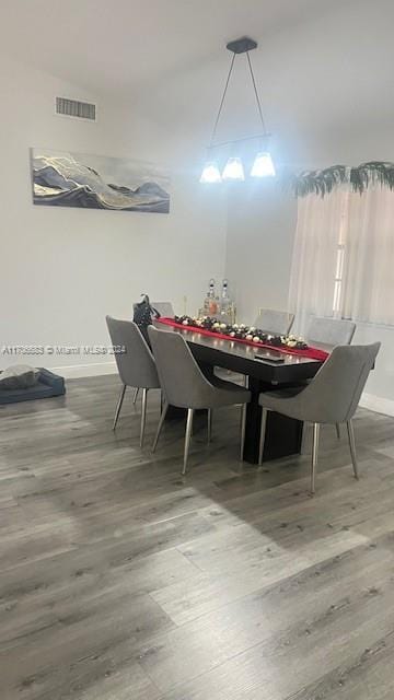 dining area with wood-type flooring