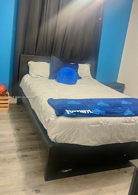 bedroom featuring hardwood / wood-style floors