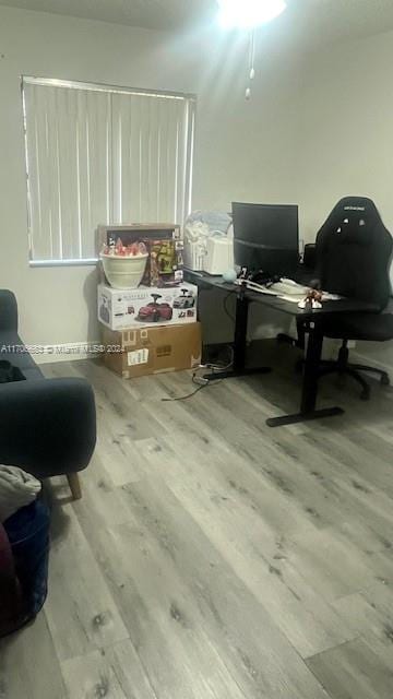 office space with light wood-type flooring