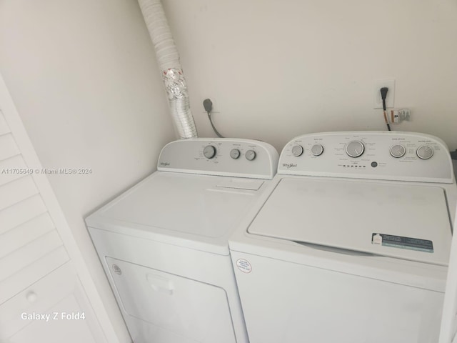 washroom with independent washer and dryer