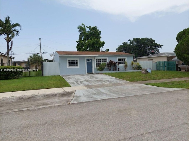 ranch-style home with a front lawn