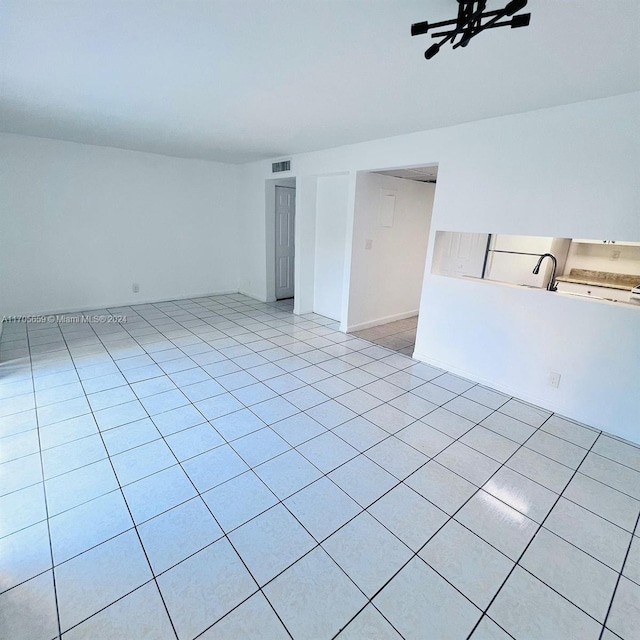 tiled spare room with sink