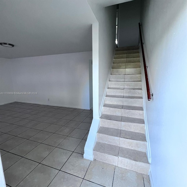 stairway featuring tile patterned floors