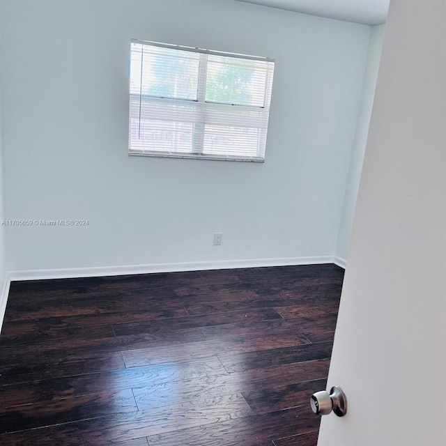 empty room featuring dark hardwood / wood-style floors