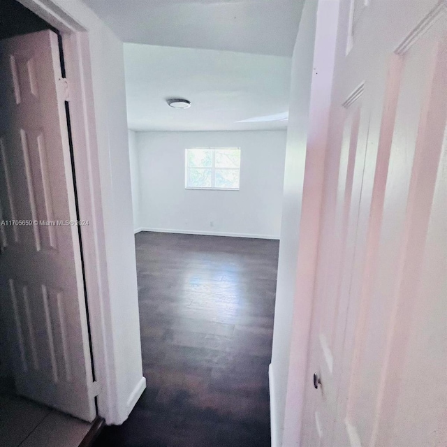 corridor with dark hardwood / wood-style floors