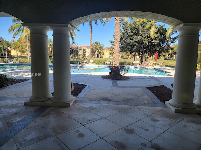 view of swimming pool featuring a patio