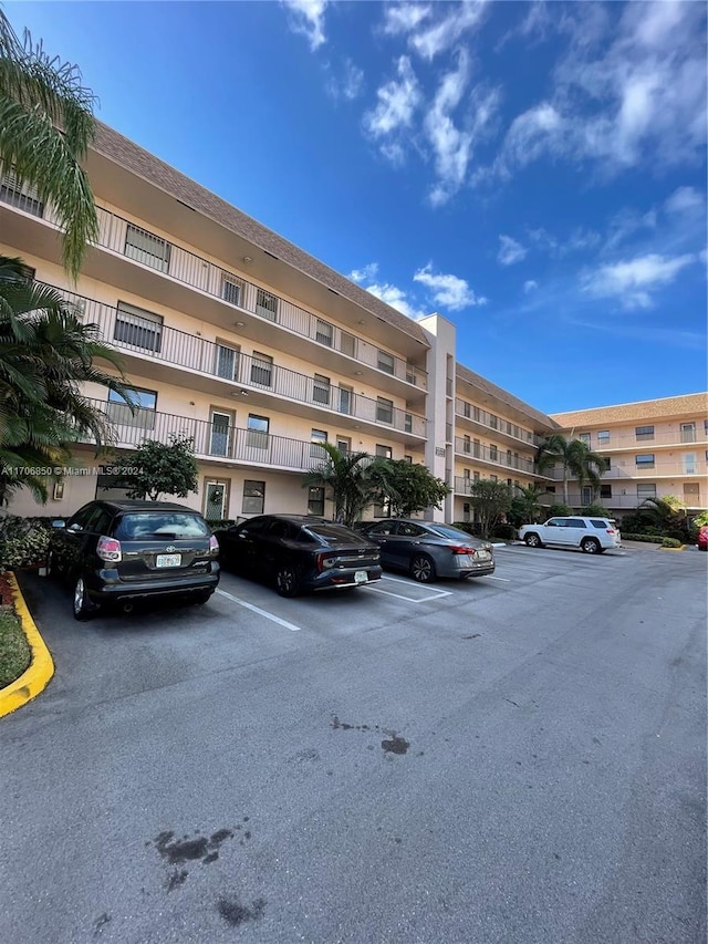 2711 NW 104th Ave Unit 406, Sunrise, FL 33322 - view of apartment building / complex with uncovered parking
