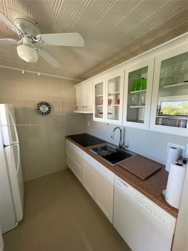 2711 NW 104th Ave Unit 406, Sunrise, FL 33322 - kitchen featuring white appliances, ceiling fan, sink, tile walls, and white cabinets