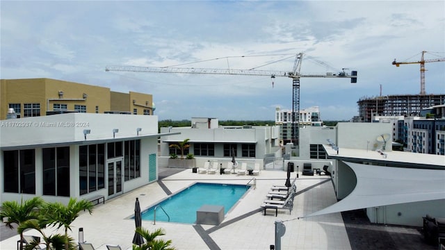 view of swimming pool with a patio area