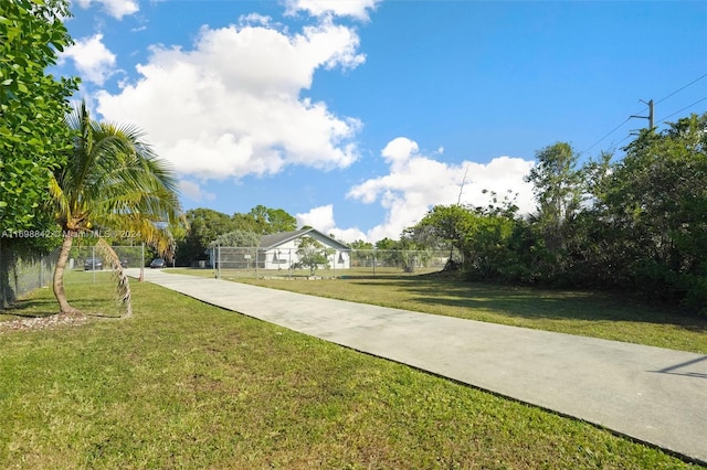 view of home's community featuring a yard