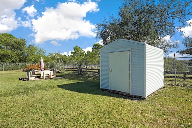 view of outdoor structure with a lawn