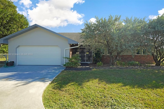 view of front of property with a front lawn and a garage