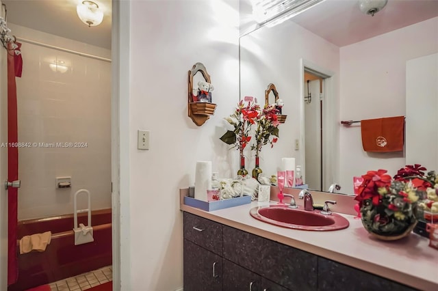 bathroom featuring shower / tub combination and vanity