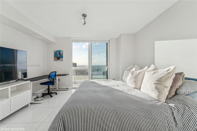 tiled bedroom featuring floor to ceiling windows