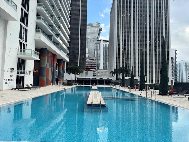 view of swimming pool featuring a patio