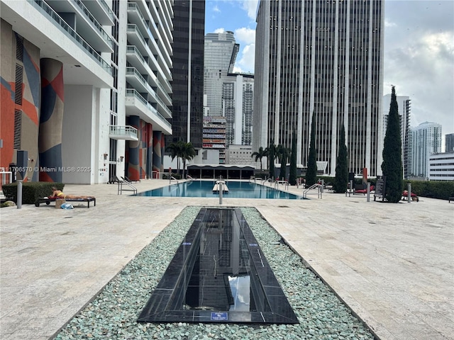 view of pool featuring a patio