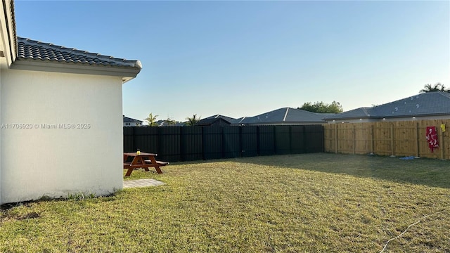 view of yard featuring a fenced backyard