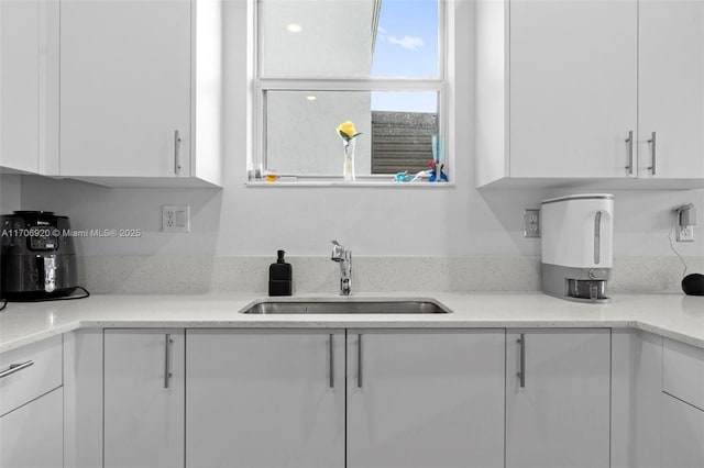 kitchen with white cabinets and a sink