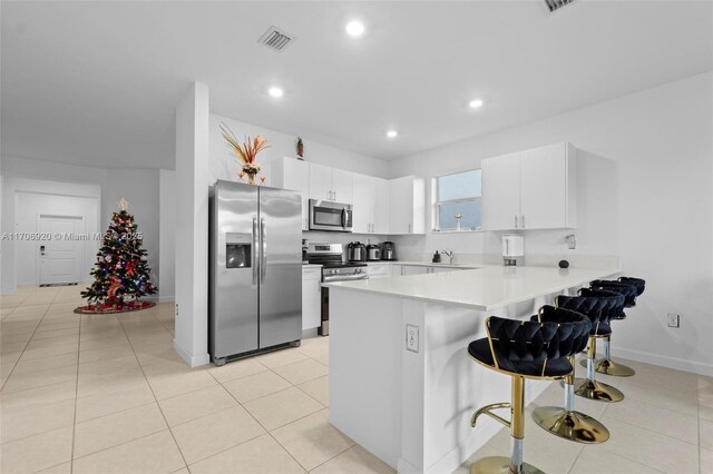 living room featuring ceiling fan and light tile patterned flooring