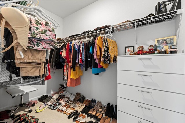 bedroom featuring light tile patterned floors and a closet