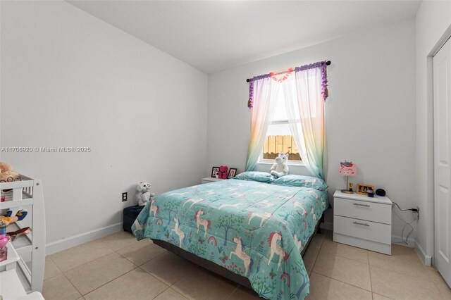 full bathroom featuring tile patterned flooring, vanity, toilet, and shower / bathtub combination with curtain