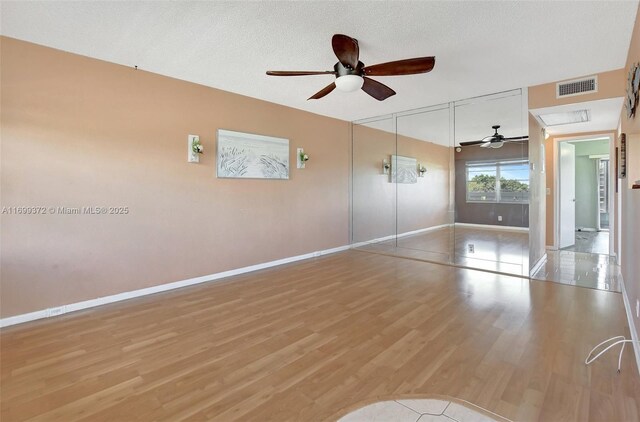 interior space featuring a closet, ceiling fan, and light wood-type flooring