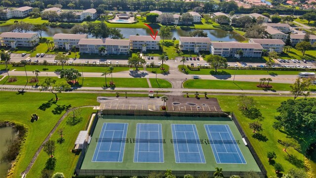 birds eye view of property with a water view