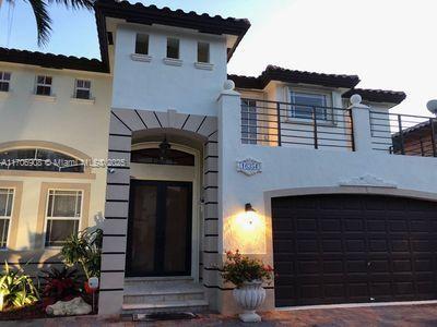 mediterranean / spanish house featuring a garage