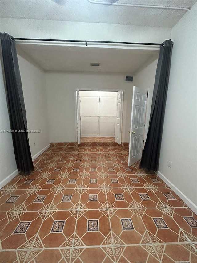 empty room featuring tile patterned floors