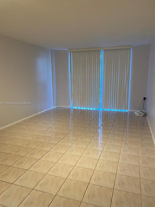 spare room with light tile patterned floors