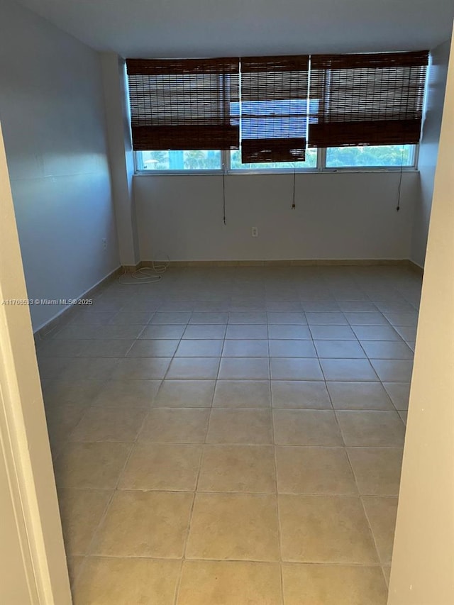 empty room with light tile patterned flooring