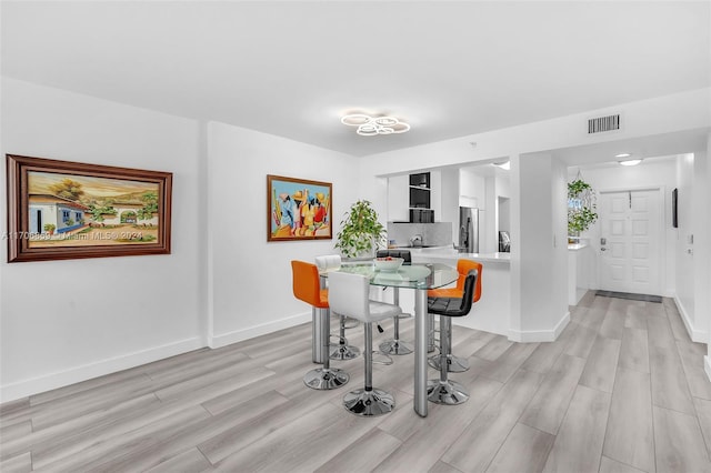 dining room featuring light wood-type flooring