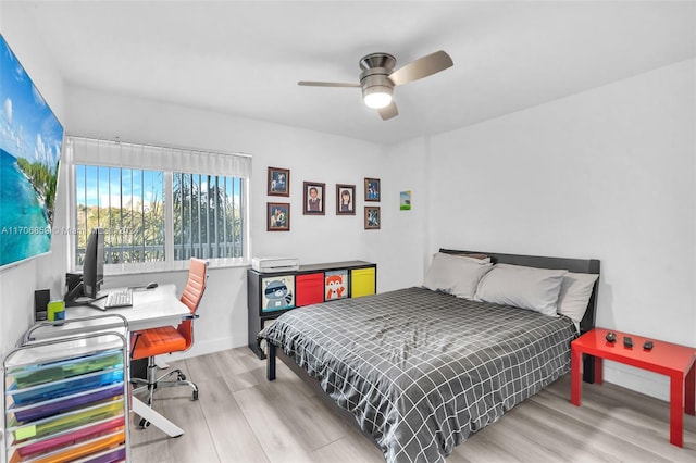 bedroom featuring light wood-type flooring and ceiling fan