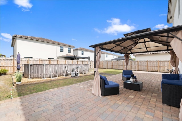 view of patio / terrace with a gazebo and outdoor lounge area