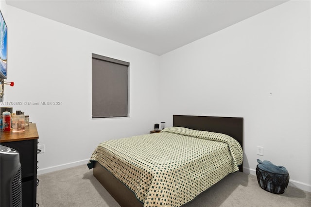 bedroom with light colored carpet