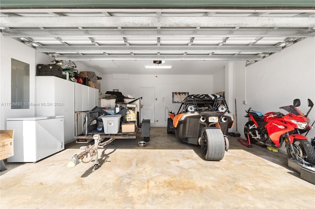 garage with electric panel and fridge