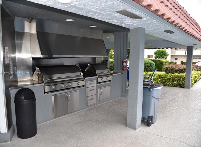 view of patio / terrace with area for grilling and a grill