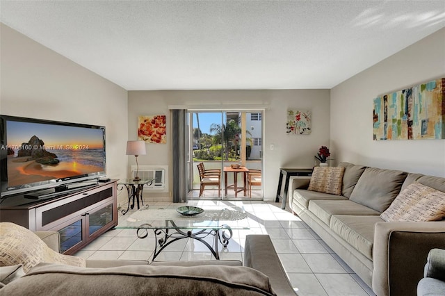 living room featuring light tile patterned floors, a textured ceiling, and heating unit