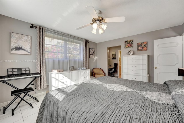 tiled bedroom featuring ceiling fan