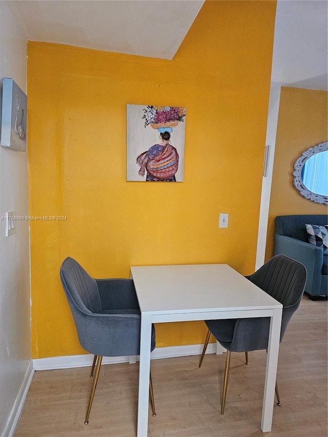 dining room with hardwood / wood-style floors