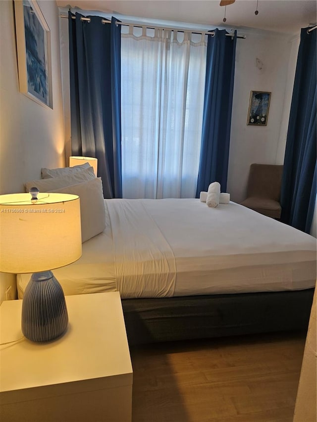 bedroom featuring wood-type flooring