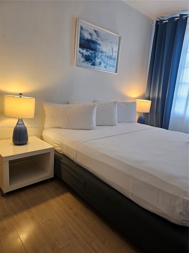 bedroom featuring wood-type flooring