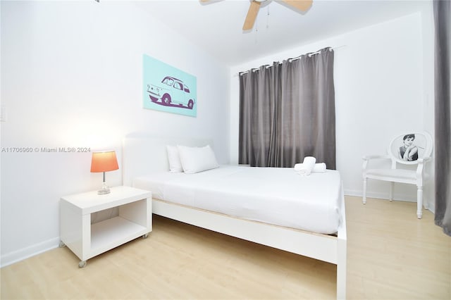 bedroom featuring ceiling fan and hardwood / wood-style floors