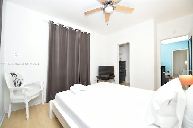 bedroom featuring ceiling fan and light hardwood / wood-style flooring