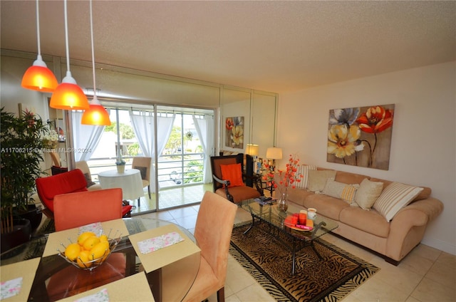 tiled living room featuring a textured ceiling