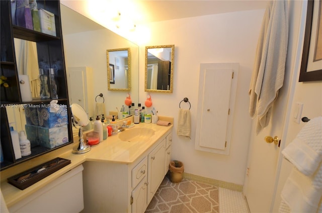 bathroom with vanity and tile patterned floors